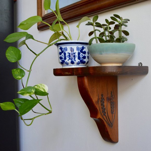 Vintage Wooden Shelf with Woodcut Embellishment